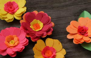 How to make Cricut Paper Daisies Embellishments; Video Tutorial from savedbylovecreations.com
